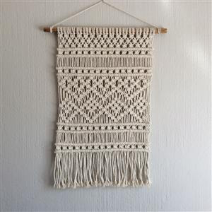 My latest creation is this modern rectangular wall hanging  with unbrushed fringe hand-crafted using a 5mm cotton macramé cord. Ready to hang in your home.
